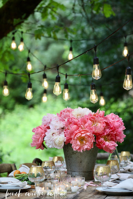 Entertaining Outdoors Using String Lights - Gorgeous Outdoor Dining by French Country Cottage