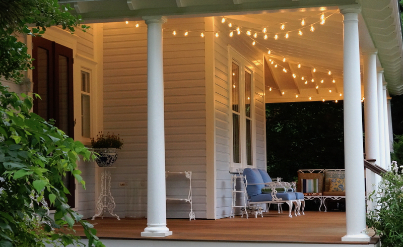 Entertaining Outdoors Using String Lights - Gorgeous Porch with String Lights by Victoria Elizbeth Barnes