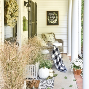 white pumpkins white mums black and white fall porch