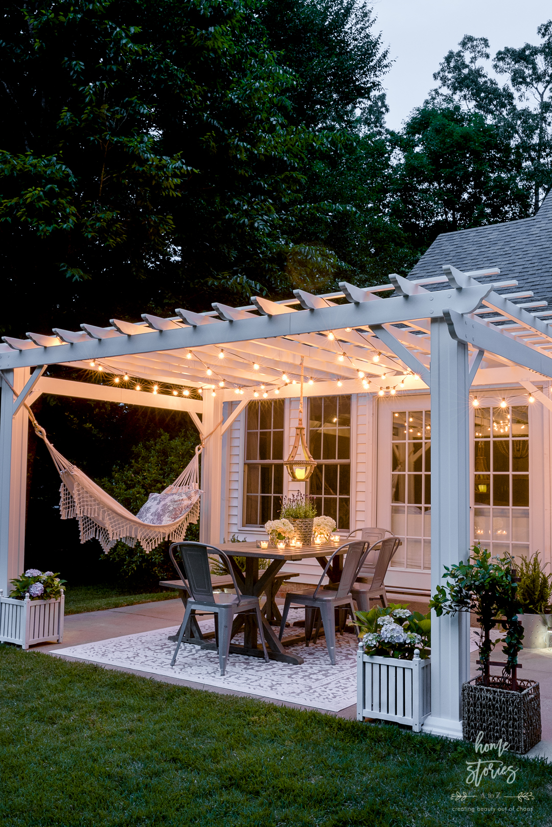 white pergola with cafe lights